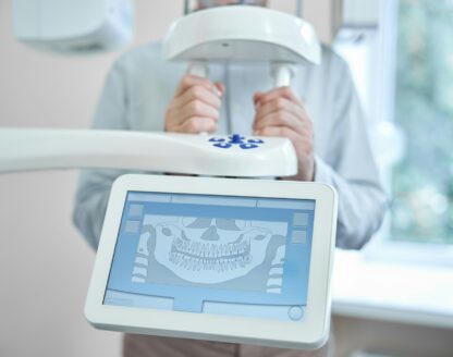 Patient of Richard L. Lachenmayr, D.M.D. in Alpha, NJ, receiving a panoramic digital dental x-ray to enhance diagnostic accuracy and care. 