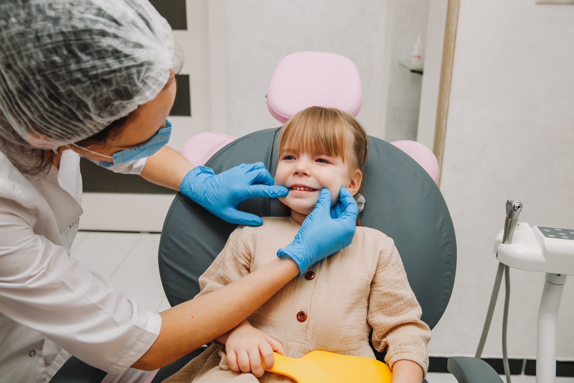 Young girl smiling during a dental exam at Richard L. Lachenmayr, D.M.D. in Alpha, NJ, highlighting the importance of regular check-ups for children.